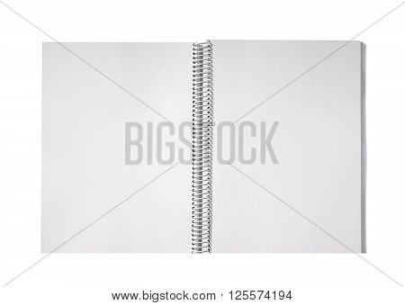 photo on the open notebook studio spiral with leaf unlined white background