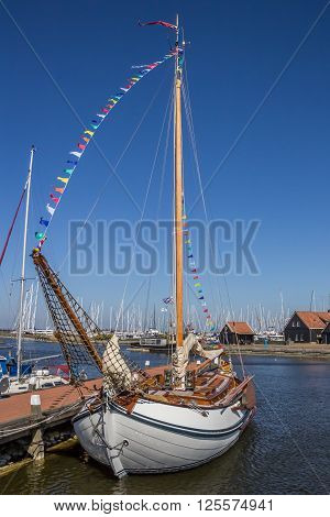 Traditional white sailing ship in Hindeloopen Netherlands