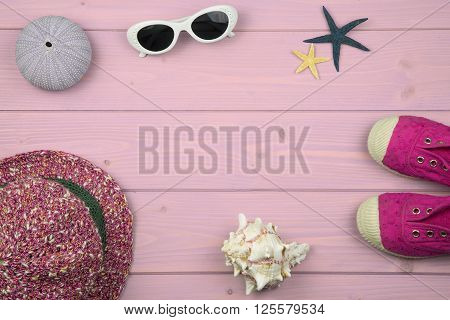 overhead of summer accessories for baby girl