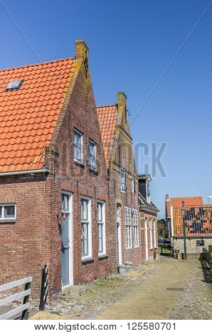 Little cobblestones street in historical city Hindeloopen Netherlands
