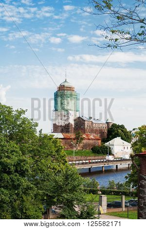Vyborg castle. Medieval Swedish castle with St. Olav tower during reconstruction. Summer day in in Vyborg Russia.