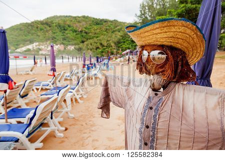 Funny scarecrow on beach. Stylish bogeyman on Phuket island Thailand.