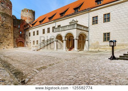BAUSKA, LATVIA - APRIL 4, 2016: Courtyard with beautiful stairs of medieval castle in Cesis town, Latvia