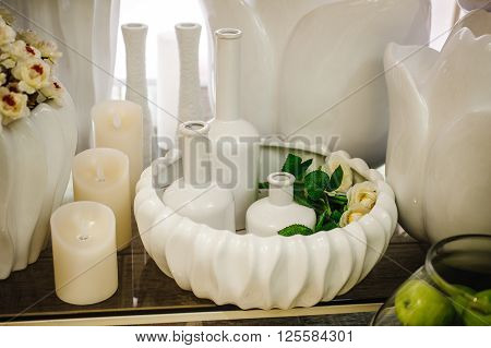 white unglazed ceramic vases with candles home decor