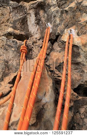 closeup of rock climbing rope on rockwall