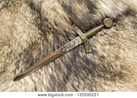 dagger on the fur pelt of a wild Wolf