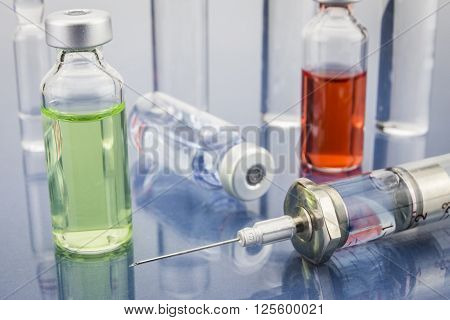 Diagnosis - Treatment and prevention. Medical Report with Composition of Medicaments - Vials Injections and Syringe. Selective Focus
** Note: Soft Focus at 100%, best at smaller sizes