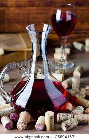 Background with glass of wine decanter and wine corcs. Wine concept
