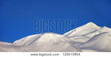 Panoramic View On Off-piste Slope And Blue Clear Sky In Morning