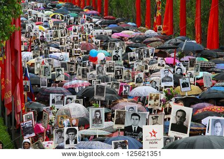 Volgograd, Russia - May 9 2015: Procession of local people with photos of their relatives in Immortal Regiment on annual Victory Day on Mamaev Hill in Volgograd