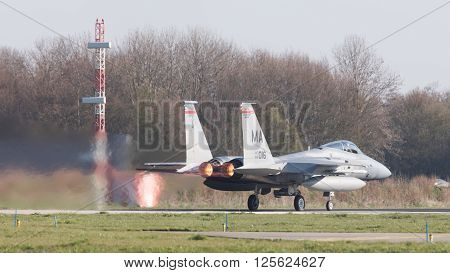 LEEUWARDEN NETHERLANDS - APRIL 11 2016: US Air Force F-15 Eagle takking off during the exercise Frisian Flag. The exercise is considered one of the most important NATO training events this year.