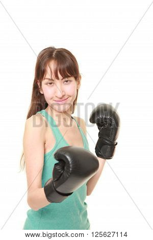 studio shot of female boxer throws a right uppercut