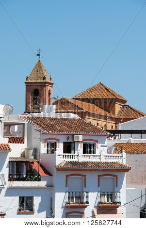 Townhouses with the church to the rear Torrox Malaga Province Andalucia Spain Western Europe.
