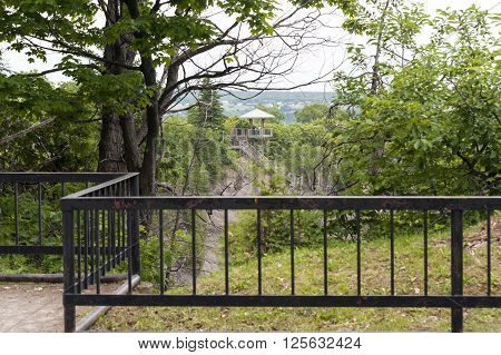 BEAUPORT QUEBEC/CANADA - JUNE 14 2010: Distant gazebo at top of long stairway to base of Montmorency Falls