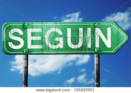 seguin road sign on a blue sky background