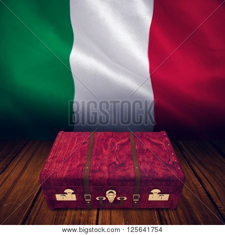 Wooden suitcase against digitally generated italian national flag