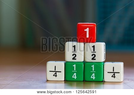 Three levels stacked up color fraction dices blurred background