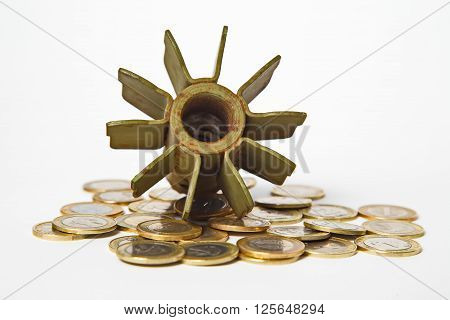 Money for War Concept, Exploded Artillery Shell and coins
