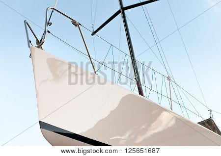 Yacht from the bottom view with blue sky behind