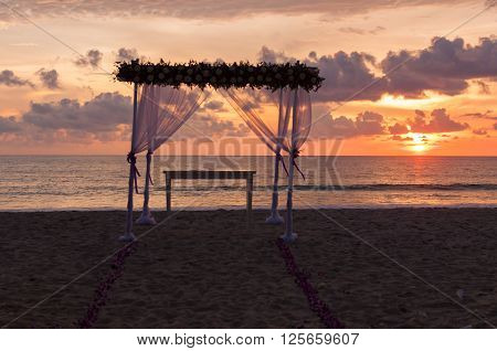 Sunset behind the decoratoin for the wedding ceremony that finished in few hours before