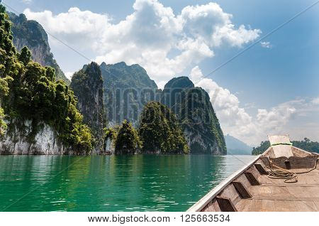 Longtail boat brings tourists to attraction point at Cheow lan lake