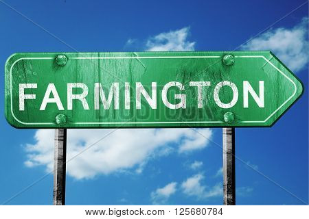 farmington road sign on a blue sky background