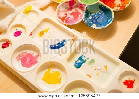 a color palette on table with happy