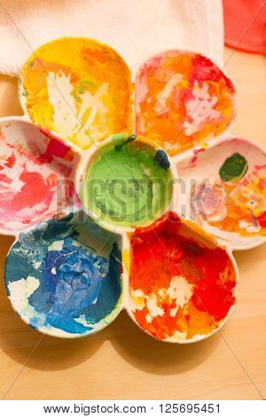 a color palette on table with happy