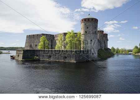 View of the fortress of Olavinlinna sunny june day. Savonlinna, Finland
