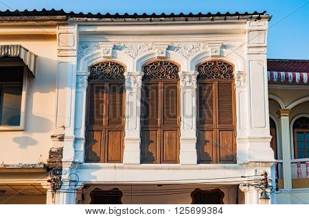 Old house in the evenng on Thalng a historic road in Phuket old town Thailand