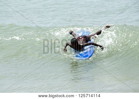 Man Body Boarder surfing on the waves Sea beach