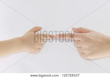 delicate hands small child nestled to one another on a white background