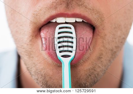 Man Cleaning Her Tongue