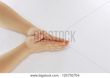 delicate hands small child nestled to one another on a white background