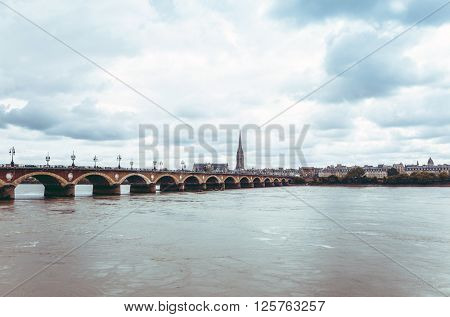 Bordeaux river bridge with St Michel cathedral, France