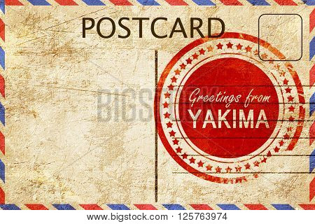 greetings from yakima, stamped on a postcard