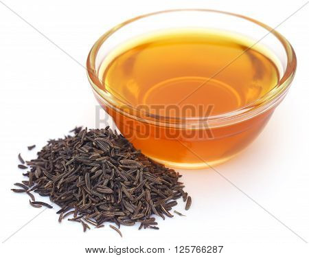 Caraway seeds with essential oil in glass bowl