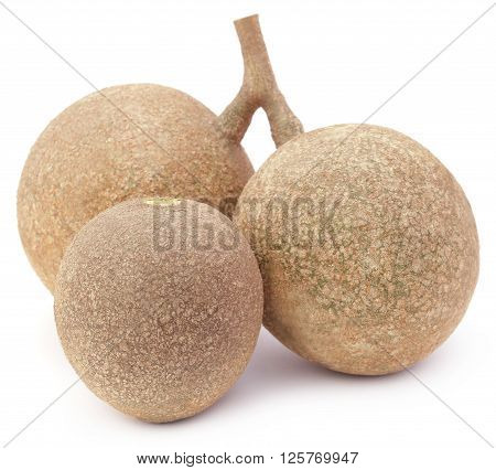 Three wood apples or kod bel of Southeast Asia over white background