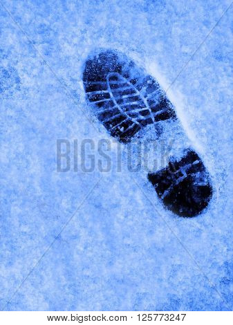 Footprint in the snow winter time treking hiking