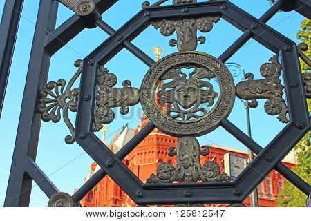 Wrought iron gate in the Alexander Garden near the Historic museum and Kremlin, Moscow, Russia