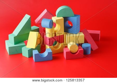 toy castle from color blocks on a red background