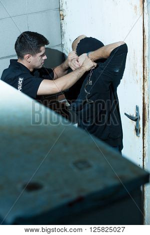 Policeman Arresting Kidnapper