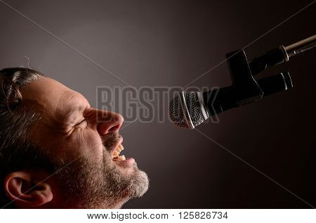 Man with a microphone in a studio