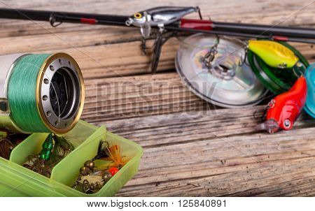 Fishing Tackles On Background Of Dry Stems