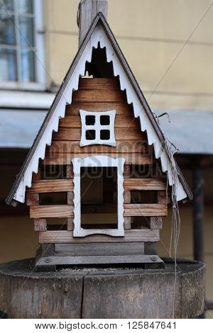 the feeder Small house birdhouse close to