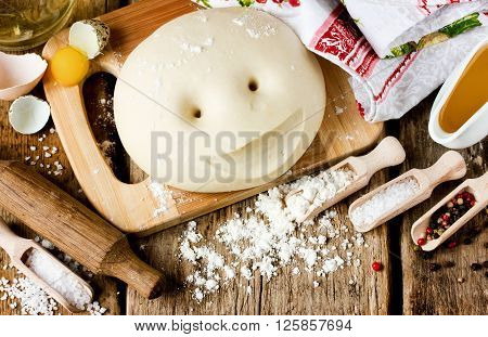 Raw dough and ingredients for making bread. Baking background top view