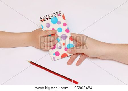 mother's arms transfer multicolored polka dots sealed spring notebook in hand for children Paintings pencil.