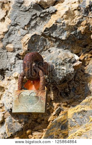 One old rusty padlock symbol of eternal love with an heart. Cinque Terre via dell'Amore (the way of love) Liguria Italy