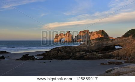 Evening at Wharariki Beach. Beautiful rock formations in New Zealand.