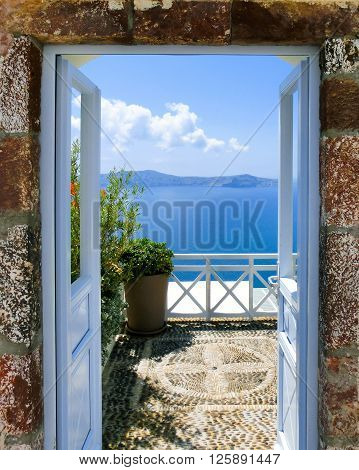 Beautiful sea view from the balcony. Oia town, Santorini island, Greece.